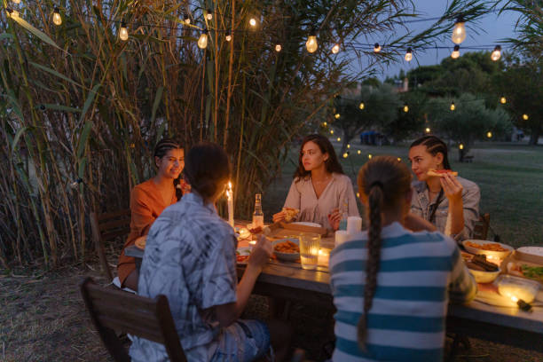 istock Female friends at the summer dinner party 1808017822