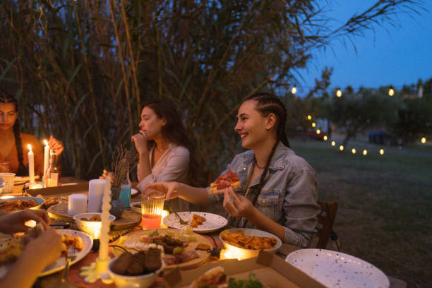 istock Female friends at the summer dinner party 1808019454