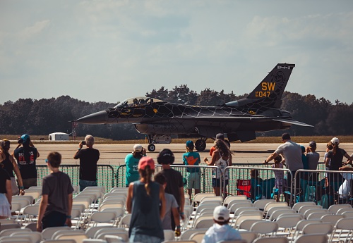 Miramar, California, USA - September 24, 2023: The crowd at America's Airshow 2023 watches the Blue Angels pass the grand stand.