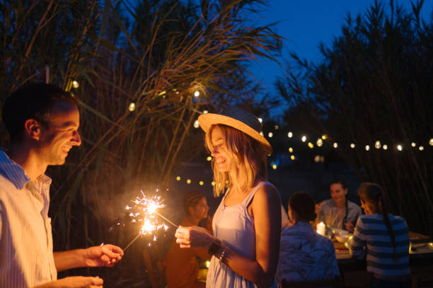 istock Loving couple on a summer dinner party with friends 1808023655