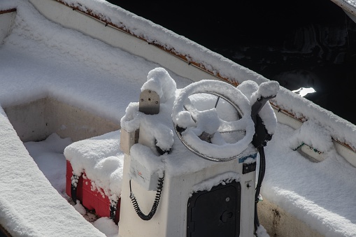 A boat covered in a thick layer of snow