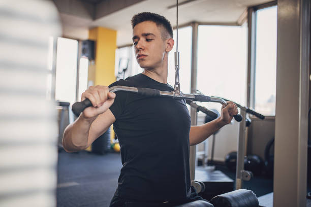 istock Man exercising in gym 1808039453