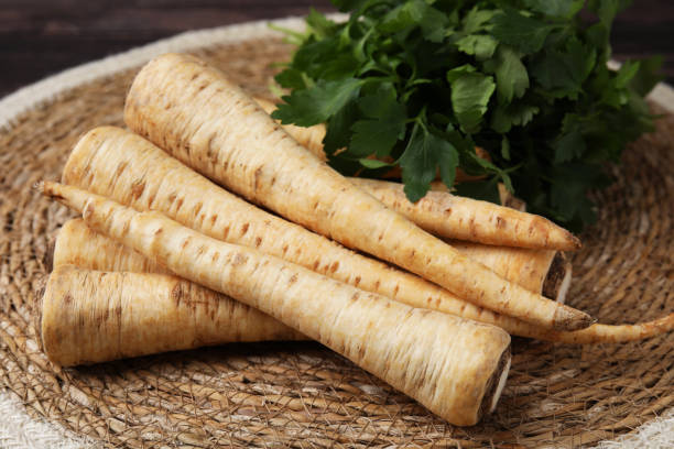 istock Raw parsley roots and fresh herb on wicker mat, closeup 1808041073