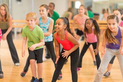 Diverse group of children in a dance fitness class