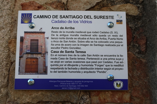 Cadalso de los Vidrios, Madrid, Spain, November 18, 2023: Informative sign of the Camino de Santiago next to an old house of Cadalso de los Vidrios, Madrid, Spain