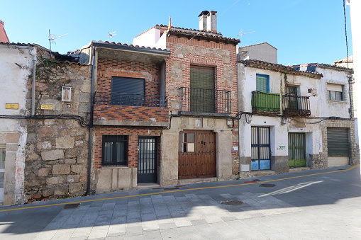 Cadalso de los Vidrios, Madrid, Spain, November 18, 2023: Facades of old houses of Cadalso de los Vidrios, Madrid, Spain