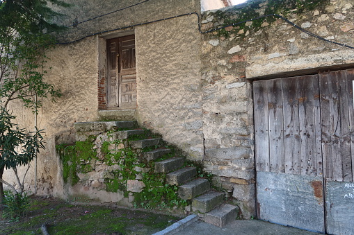 Traditional wooden old door and window at a stone house in Bulgaria