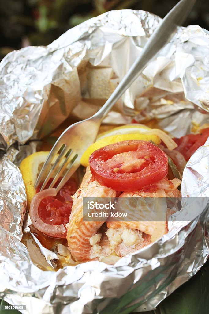 Foil Packet Fish Vertical image of fish grilled in a foil packet. Foil - Material Stock Photo