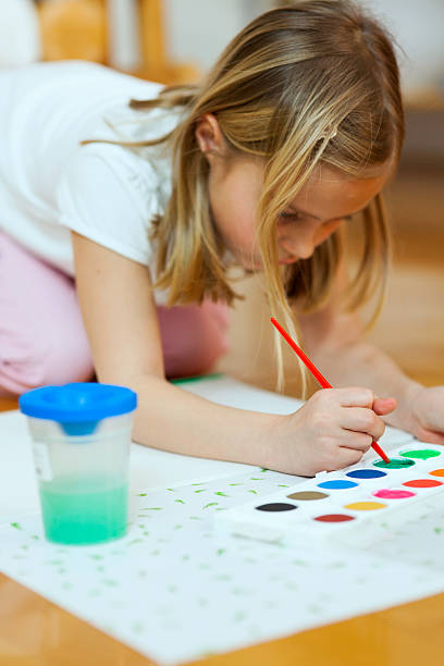 istock Llittle girl drawing on a paper 180806255