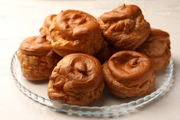 istock Delicious profiteroles on white table, closeup view 1808062936
