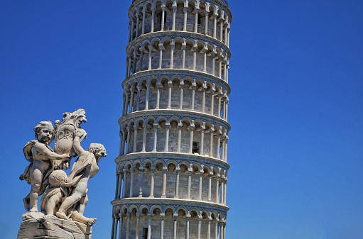 summer, pisa, a detail of the world cultural heritage of the famous leaning tower of pisa with putti
