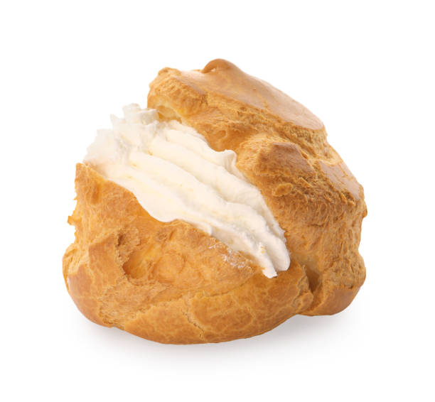 istock Delicious profiterole with cream filling isolated on white 1808065317