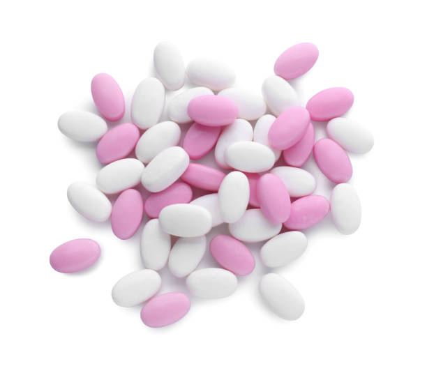 istock Different tasty dragee candies on white background, top view 1808066896