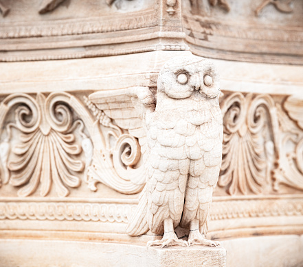 Close-up of a statue of an owl, part of a marble plinth  located at the Academy of Athens in the Greek capital city.\n\nCompleted in 1885 by Leonidas Drosis.