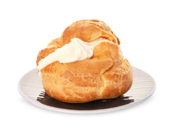 Delicious profiterole with cream filling isolated on white
