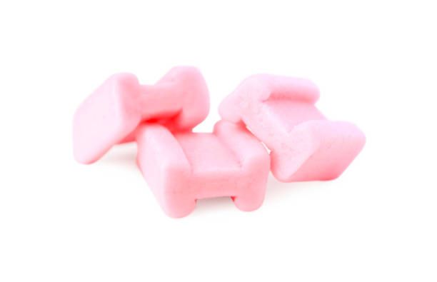 istock Tasty pink chewing gums isolated on white 1808067430