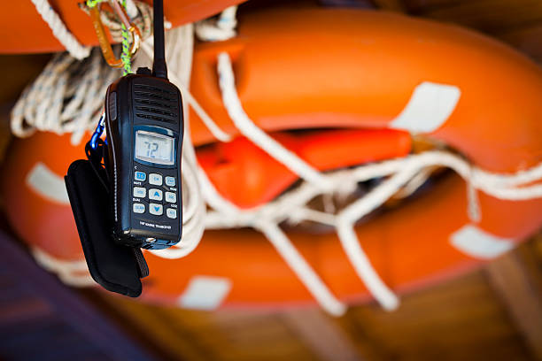 Mobile phone tied with rope to life preserver stock photo