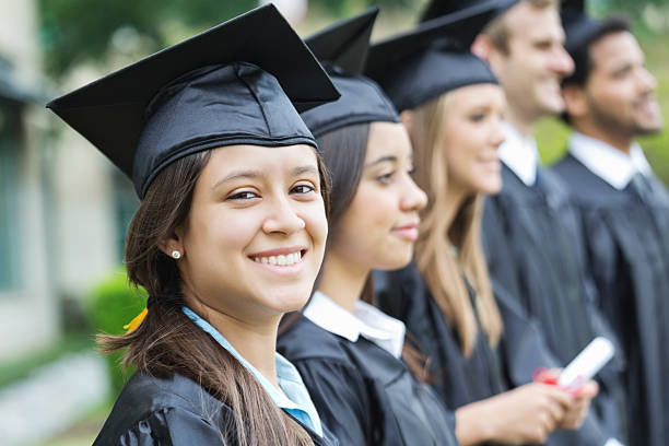 istock Hispanic student smiling waiting for her diploma at graduation 180807215