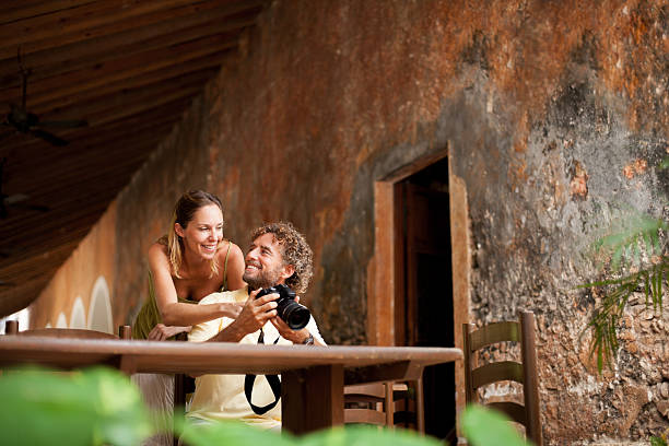 istock Happy tourist looking at their pictures 180807315