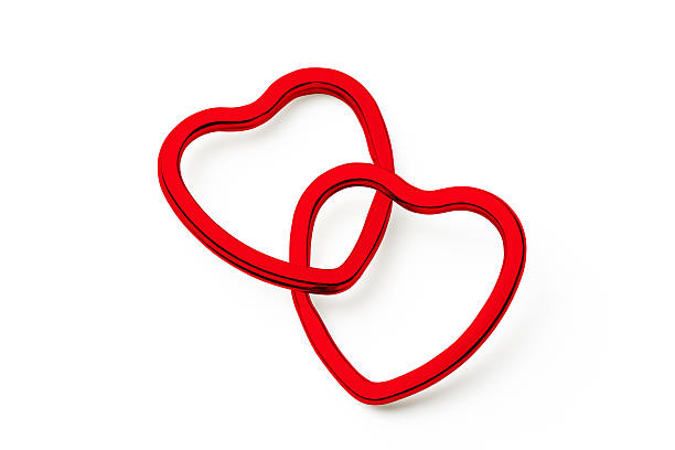 Two red heart shape rings isolated on white background with clipping path.
