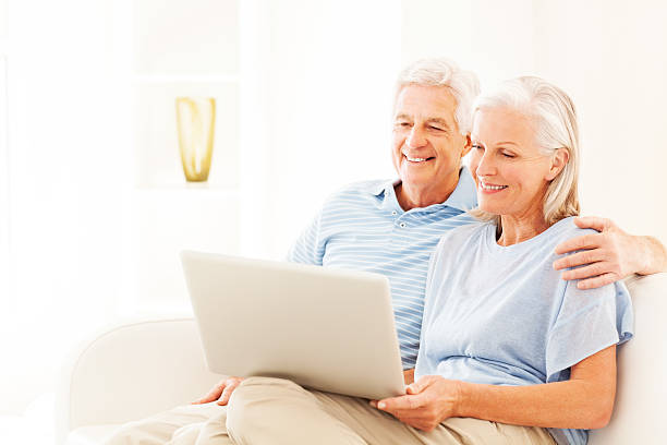 istock Happy Senior Couple Using Laptop 180807424