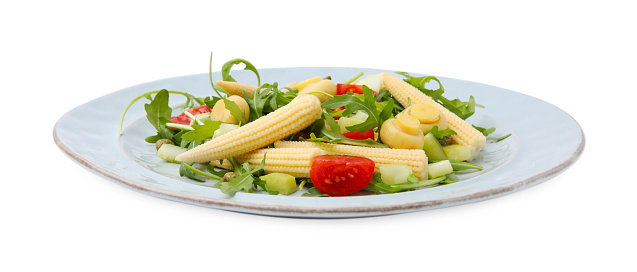 Tasty baby corn with vegetables, arugula and mushrooms isolated on white