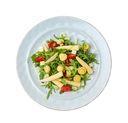 Tasty baby corn with vegetables, arugula and mushrooms isolated on white, top view