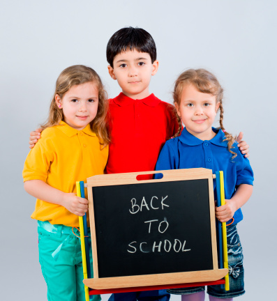 Three preschooler is holding blackboard.
