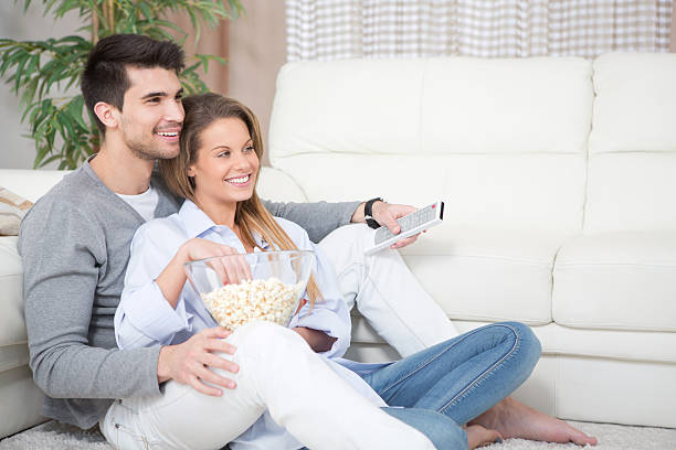 istock Couple at home watching TV. 180808208