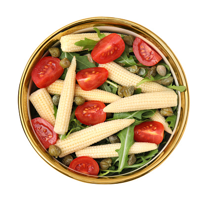 Tasty baby corn with tomatoes, arugula and capers isolated on white, top view