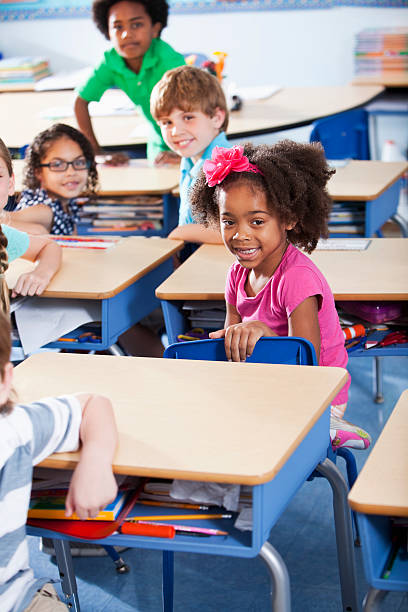 istock Group of children in classroom 180808473