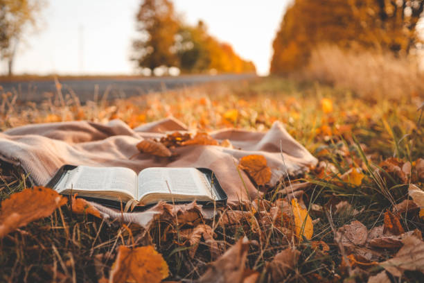 istock Open Bible on a blanket, autumn 1808087088