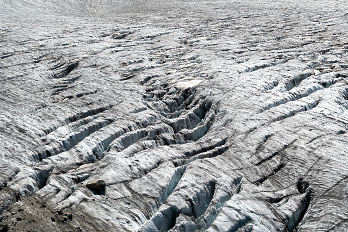 Glacial ice field with crevasses exposed to sun in summer on the Tour Glacier in Chamonix France