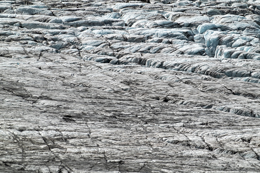 Glacial ice field with crevasses exposed to sun in summer on the Tour Glacier in Chamonix France