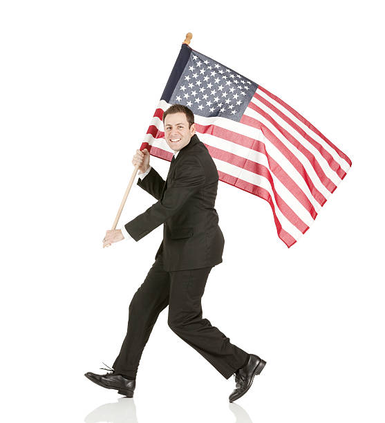 istock Smiling businessman holding an American flag 180808913