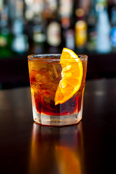 Classic Negroni cocktail on the  black bar table stock photo