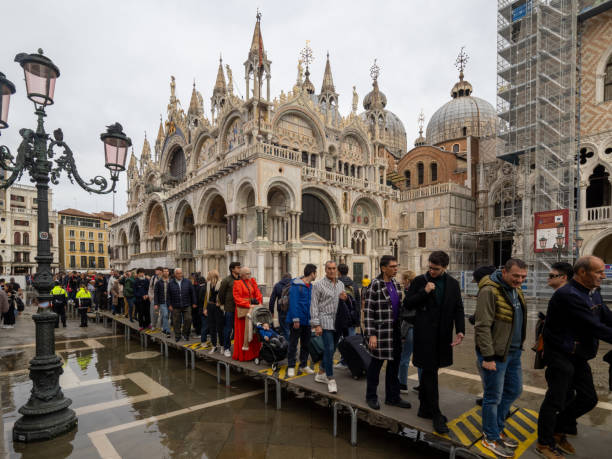 People queueing to climb the Campanile tower in Venice, Italy stock photo