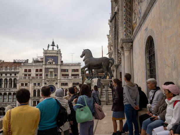 Tourists on the horses balcony at San Marco cathedral, Venice, Italy stock photo