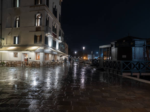 Fondamenta del Monastero street on a rainy night, Venice, Italy stock photo