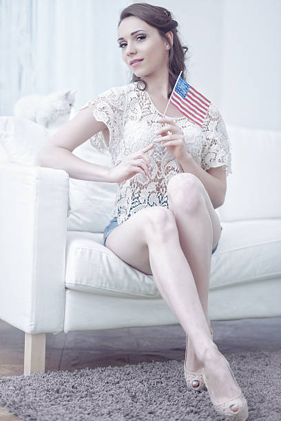 istock Female Holding An American Flag 180809431