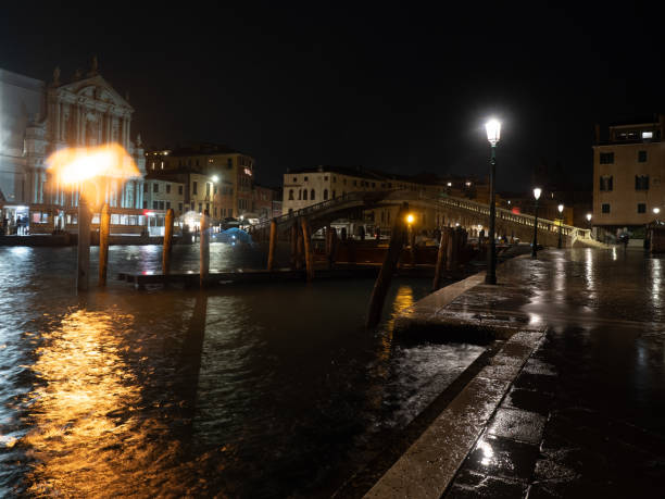 Canal Grande and Ponte degli Scalzi bridge on a rainy night, Venice, Italy stock photo