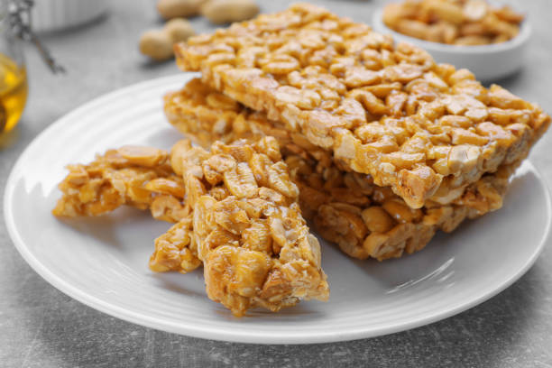 istock Delicious peanut kozinaki bars on white plate, closeup 1808094672
