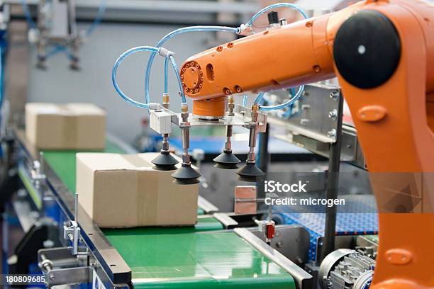 Robotic Arm On A Production Line Stock Photo - Download Image Now - Robot, Automated, Machinery
