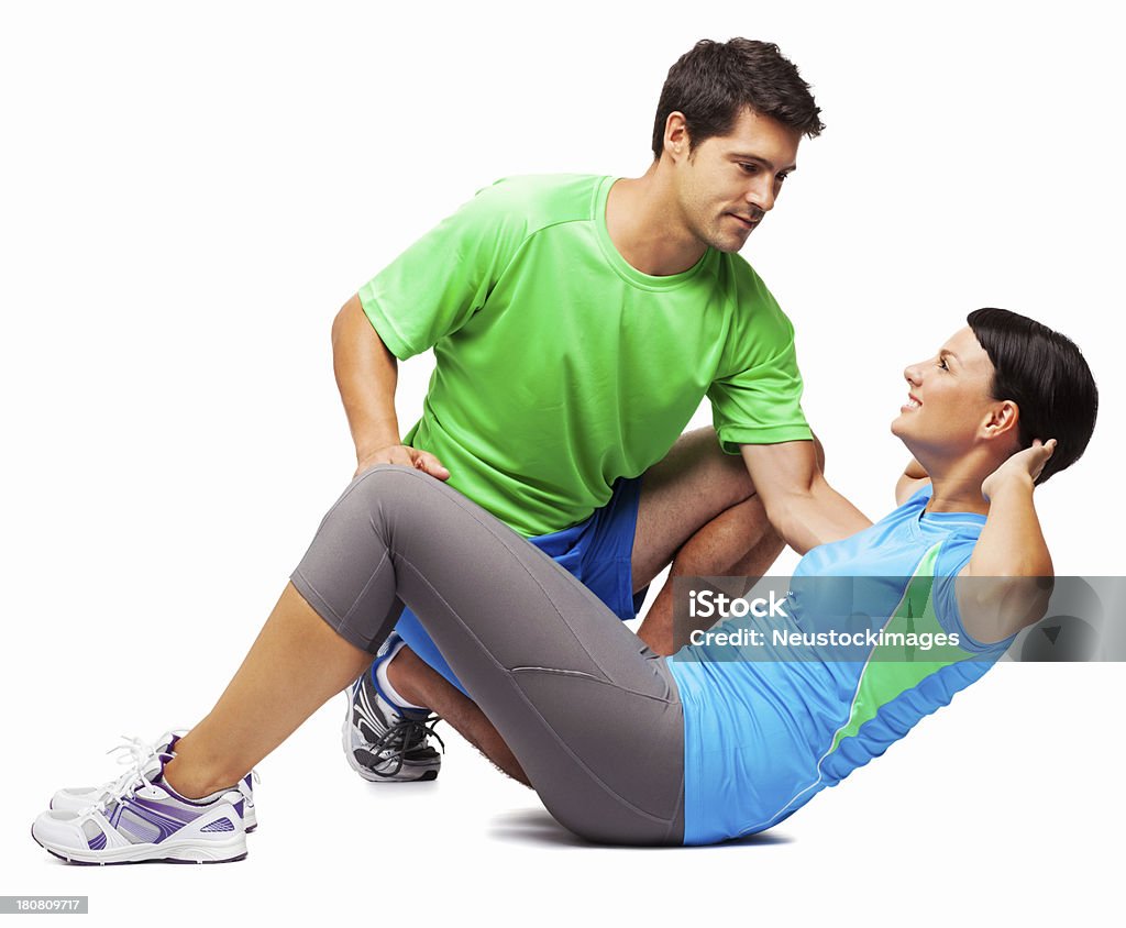 Giovane donna con Personal Trainer-isolato - Foto stock royalty-free di Istruttore di ginnastica