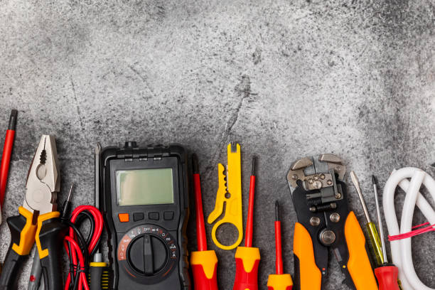 istock Electrician equipment on marble background with copy space.Top view.Electrician tool set.Multimeter, tester,screwdrivers,cutters,duct tape,lamps,tape measure and wires.Flet lay. 1808098537