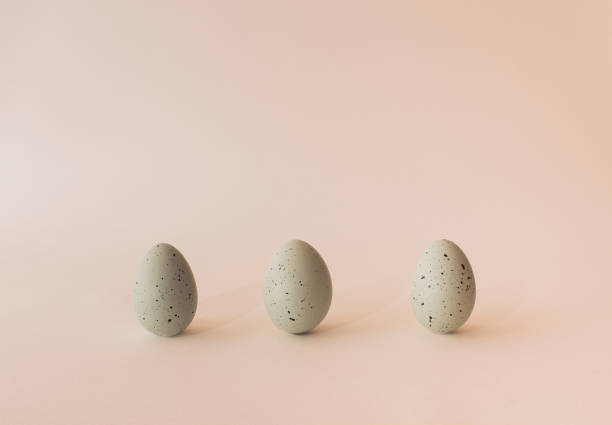 istock Pastel green easter  eggs on light beige background. Minimal concept. 1808099124