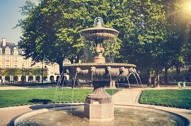 istock Fountain on the Place des Vosges in Paris 180810036