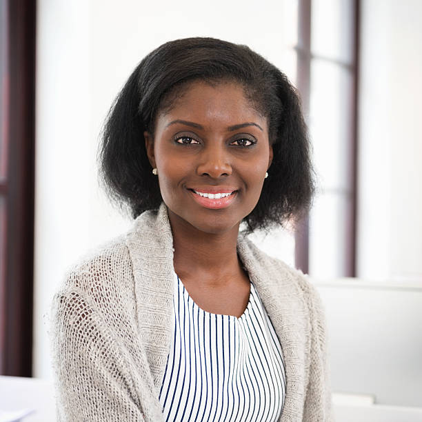 istock Young Businesswoman Smiling At Work Place 180810165