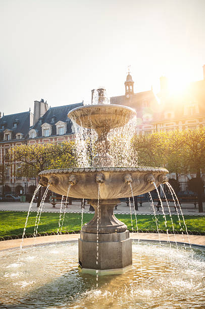 istock Fountain on the Place des Vosges in Paris 180810369