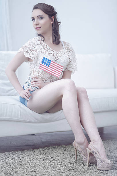 Female Holding An American Flag